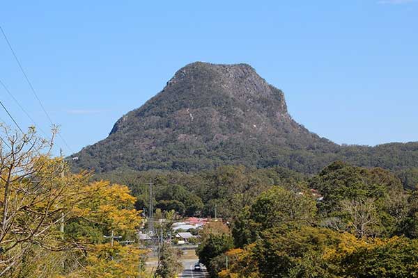 Mount Cooroora towering over the Noosa Hinterland town of Pomona, Queensland.